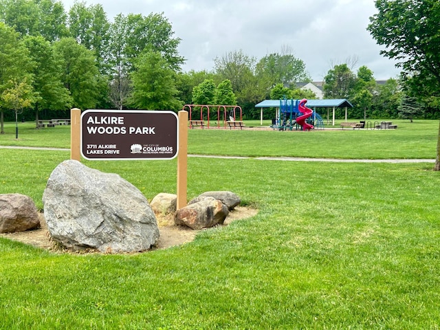view of home's community with a lawn