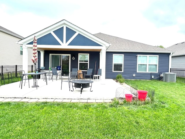 back of house featuring a patio area, central AC unit, and a shingled roof