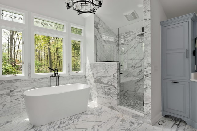 7870 Cook Rd, Plain City, OH 43064 - full bathroom with a marble finish shower, marble tiled flooring, a freestanding tub, and a chandelier