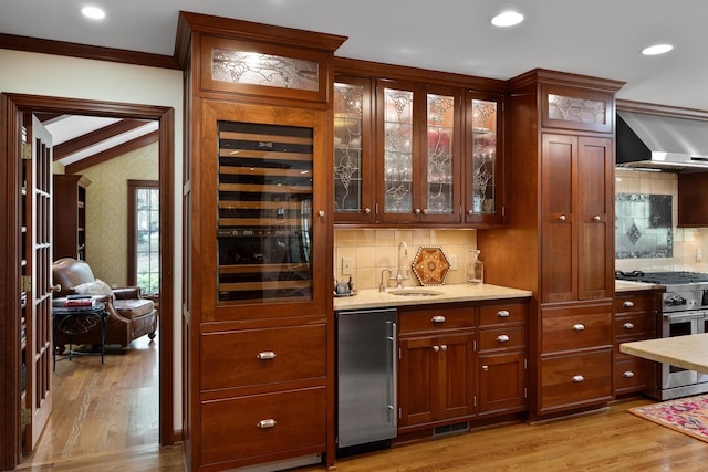 7870 Cook Rd, Plain City, OH 43064 - indoor wet bar with stainless steel stove, wall chimney exhaust hood, light wood-style floors, backsplash, and wine cooler