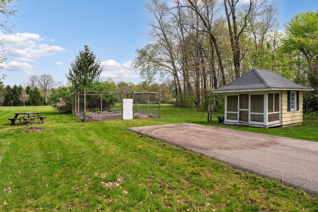 7870 Cook Rd, Plain City, OH 43064 - view of grassy yard with view of wooded area and an outbuilding
