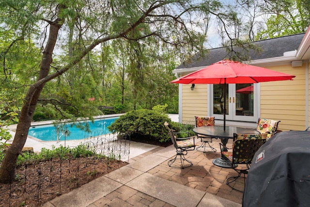 7870 Cook Rd, Plain City, OH 43064 - outdoor pool with french doors, a patio area, grilling area, and outdoor dining space