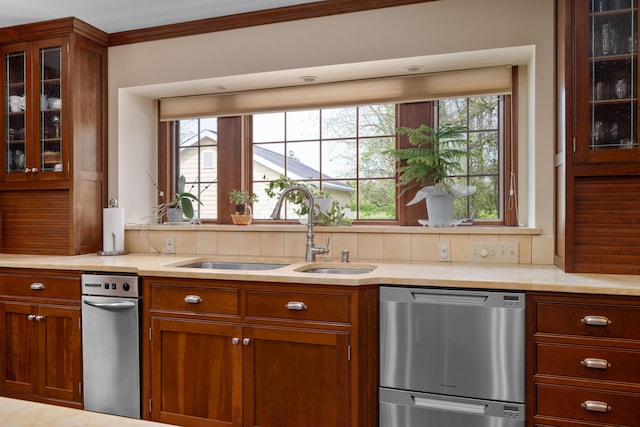 7870 Cook Rd, Plain City, OH 43064 - kitchen featuring dishwasher, a sink, light countertops, glass insert cabinets, and ornamental molding