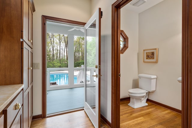 7870 Cook Rd, Plain City, OH 43064 - doorway to outside with light wood-type flooring, baseboards, and a ceiling fan