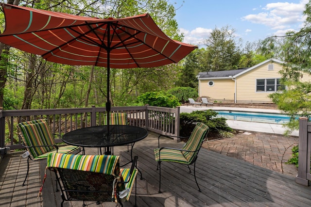 7870 Cook Rd, Plain City, OH 43064 - wooden deck featuring outdoor dining space and an outdoor pool
