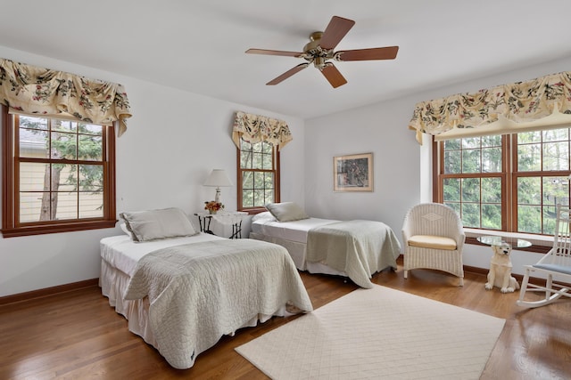 7870 Cook Rd, Plain City, OH 43064 - bedroom with wood finished floors, baseboards, and a ceiling fan