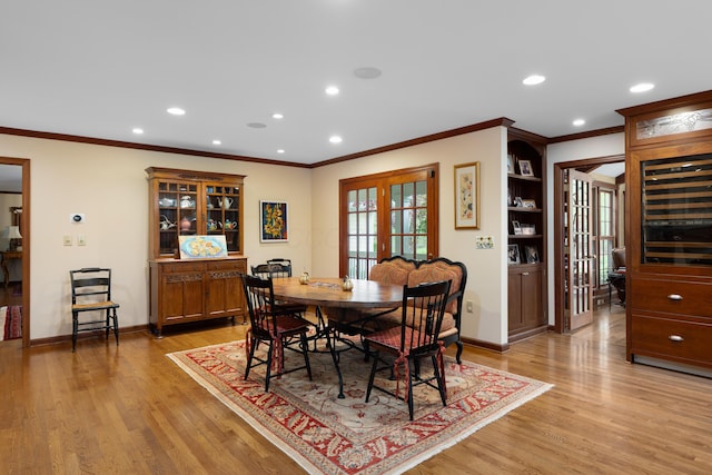 7870 Cook Rd, Plain City, OH 43064 - dining room with light wood finished floors, ornamental molding, recessed lighting, french doors, and baseboards