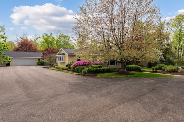 7870 Cook Rd, Plain City, OH 43064 - view of front of house featuring asphalt driveway and a garage