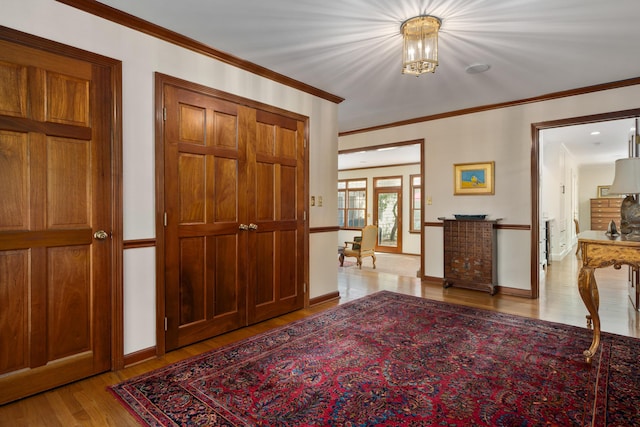 7870 Cook Rd, Plain City, OH 43064 - foyer entrance featuring light wood finished floors, ornamental molding, and a chandelier