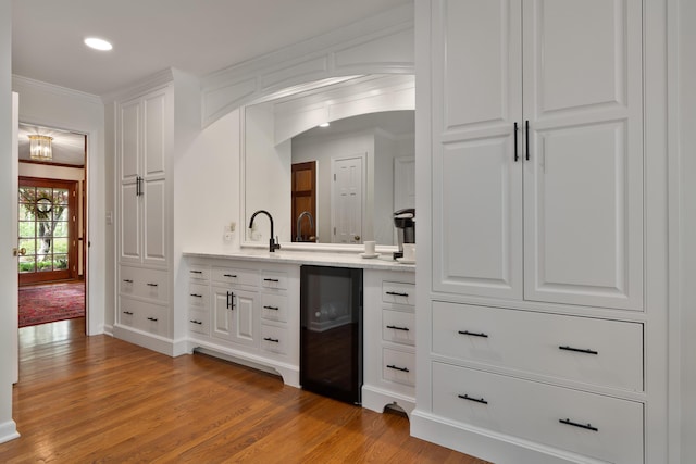 7870 Cook Rd, Plain City, OH 43064 - bathroom with beverage cooler, ornamental molding, wood finished floors, vanity, and recessed lighting