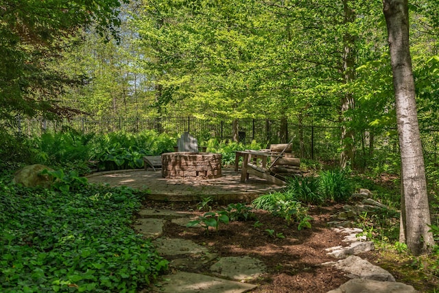 7870 Cook Rd, Plain City, OH 43064 - view of yard with an outdoor fire pit, fence, and a forest view