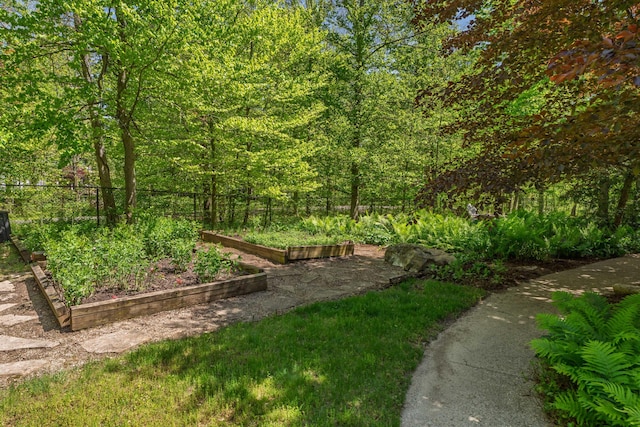 7870 Cook Rd, Plain City, OH 43064 - view of yard with a garden, fence, and a wooded view