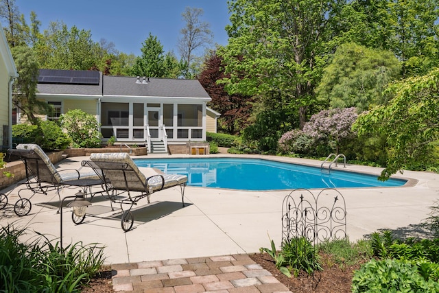 7870 Cook Rd, Plain City, OH 43064 - outdoor pool featuring a sunroom, a patio area, and view of wooded area