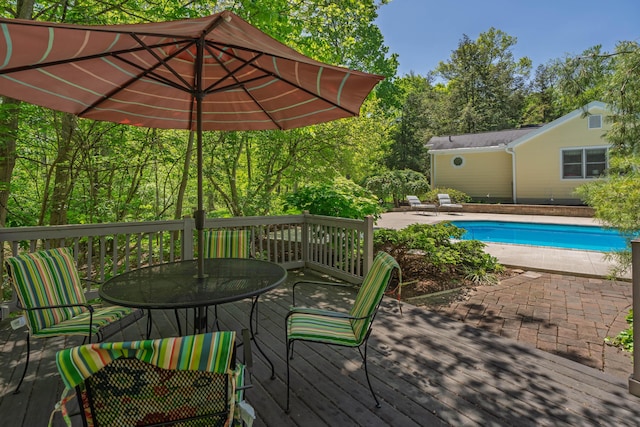 7870 Cook Rd, Plain City, OH 43064 - wooden terrace featuring outdoor dining space and an outdoor pool