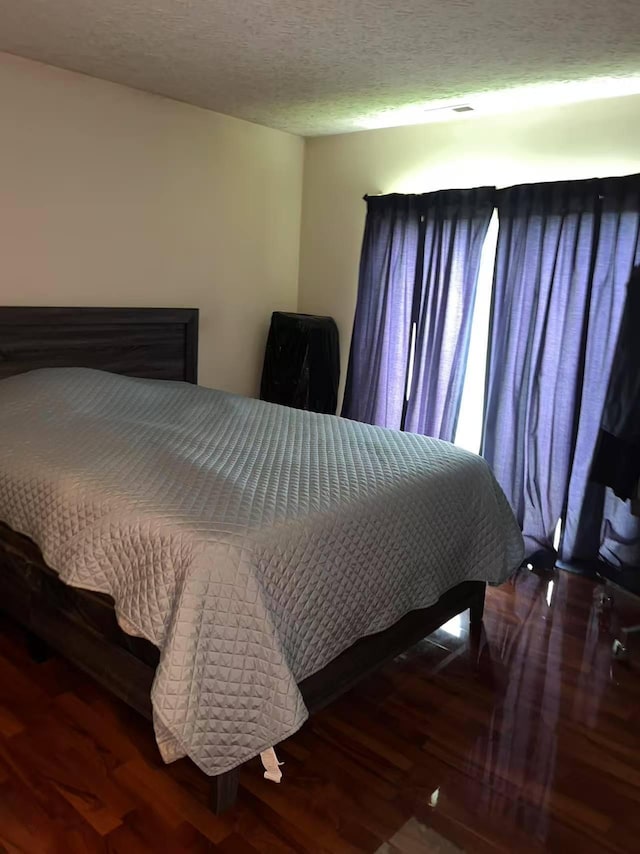 bedroom featuring wood finished floors