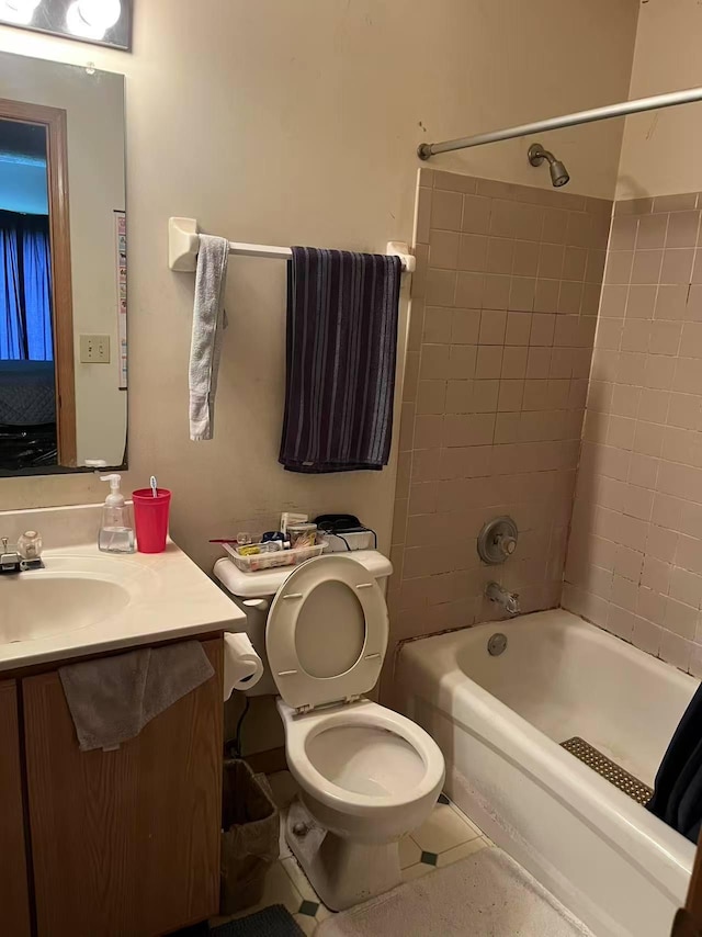 bathroom featuring toilet, washtub / shower combination, and vanity