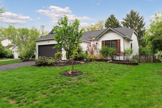 5372 Thistledown Dr, Columbus, OH 43221 - ranch-style house with an attached garage, asphalt driveway, and a shingled roof