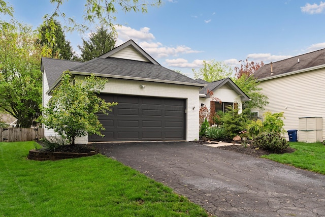 5372 Thistledown Dr, Columbus, OH 43221 - single story home featuring an attached garage, a front yard, driveway, and roof with shingles