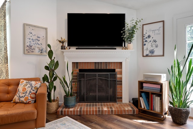 5372 Thistledown Dr, Columbus, OH 43221 - living room featuring wood finished floors and a brick fireplace
