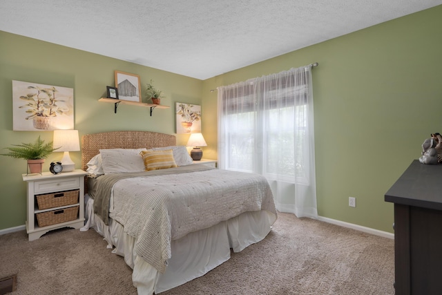 5372 Thistledown Dr, Columbus, OH 43221 - bedroom featuring carpet, baseboards, and a textured ceiling