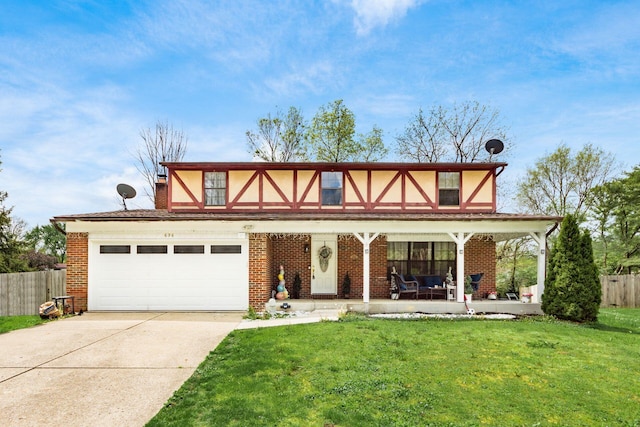 696 Brenton Pl, Columbus, OH 43213 - view of front of home featuring a porch, fence, brick siding, concrete driveway, and a front lawn