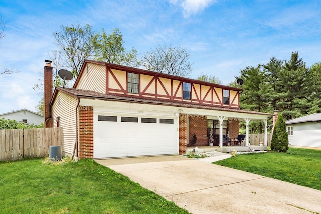696 Brenton Pl, Columbus, OH 43213 - view of front of home featuring a chimney, fence, concrete driveway, a front yard, and brick siding