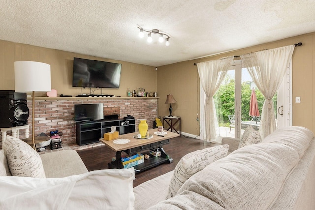 696 Brenton Pl, Columbus, OH 43213 - living room featuring a textured ceiling and wood finished floors