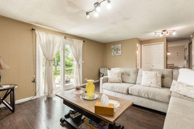 696 Brenton Pl, Columbus, OH 43213 - living room with a textured ceiling, baseboards, and dark wood finished floors