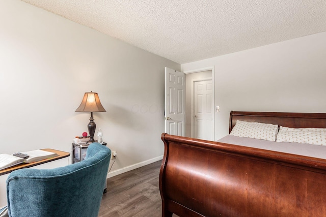 696 Brenton Pl, Columbus, OH 43213 - bedroom with baseboards, a textured ceiling, and wood finished floors