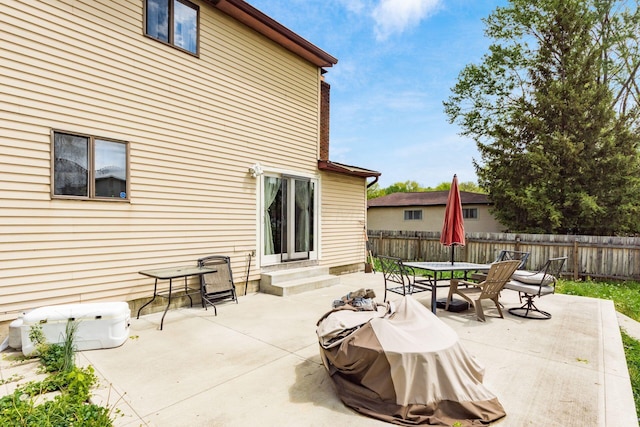 696 Brenton Pl, Columbus, OH 43213 - view of patio with a fenced backyard, entry steps, and outdoor dining area