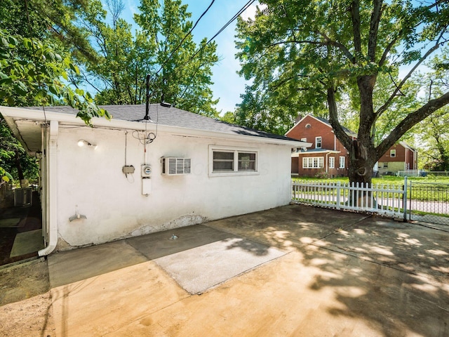 2584 E 5th Ave, Columbus, OH 43219 - rear view of property with stucco siding, a shingled roof, and a patio area