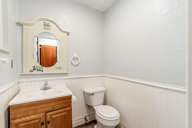 2584 E 5th Ave, Columbus, OH 43219 - half bath featuring a wainscoted wall and vanity