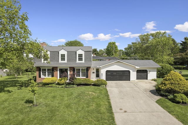 4188 Gavin Ln, Upper Arlington, OH 43220 - dutch colonial featuring an attached garage, brick siding, concrete driveway, a front lawn, and a shingled roof