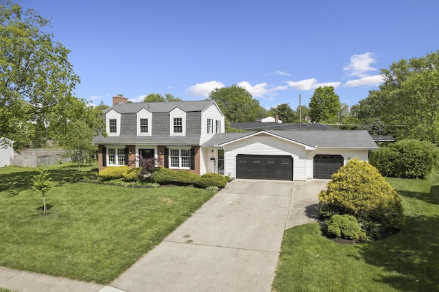 4188 Gavin Ln, Upper Arlington, OH 43220 - colonial inspired home with a garage, a chimney, a front lawn, concrete driveway, and brick siding