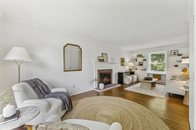 4188 Gavin Ln, Upper Arlington, OH 43220 - living room with ornamental molding, dark wood-style floors, a fireplace, and baseboards