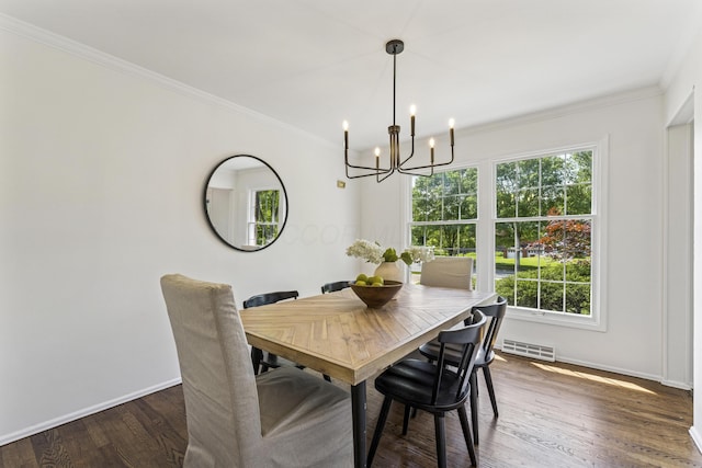 4188 Gavin Ln, Upper Arlington, OH 43220 - dining space featuring a chandelier, healthy amount of natural light, baseboards, and crown molding