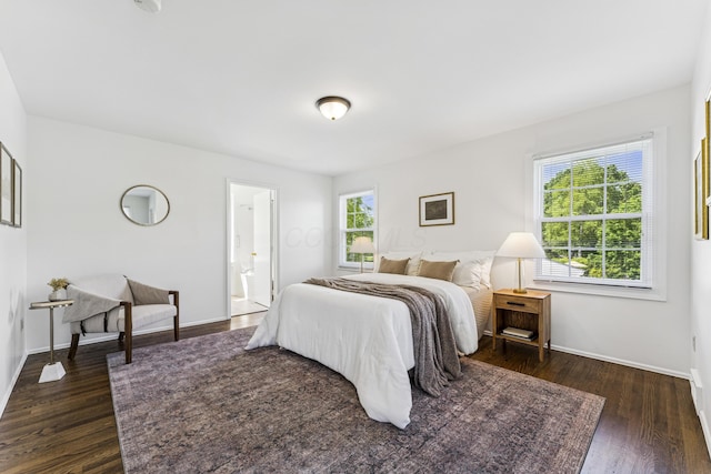 4188 Gavin Ln, Upper Arlington, OH 43220 - bedroom featuring dark wood finished floors, baseboards, and ensuite bath