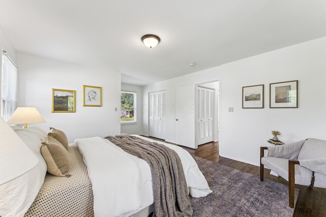 4188 Gavin Ln, Upper Arlington, OH 43220 - bedroom with two closets, wood finished floors, and baseboards