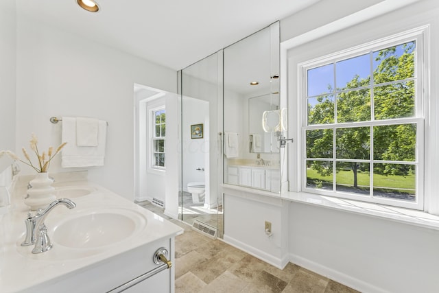 4188 Gavin Ln, Upper Arlington, OH 43220 - full bathroom featuring double vanity, healthy amount of natural light, toilet, and recessed lighting