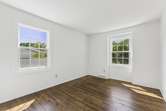 4188 Gavin Ln, Upper Arlington, OH 43220 - empty room featuring dark wood-style flooring and baseboards