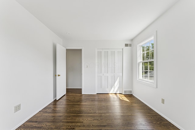 4188 Gavin Ln, Upper Arlington, OH 43220 - unfurnished bedroom with a closet, dark wood-type flooring, and baseboards