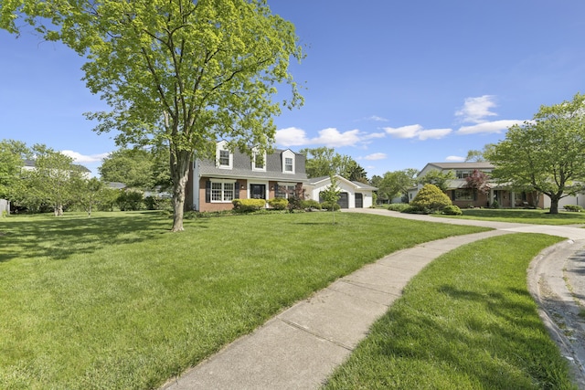 4188 Gavin Ln, Upper Arlington, OH 43220 - cape cod home with driveway, a front yard, an attached garage, and brick siding