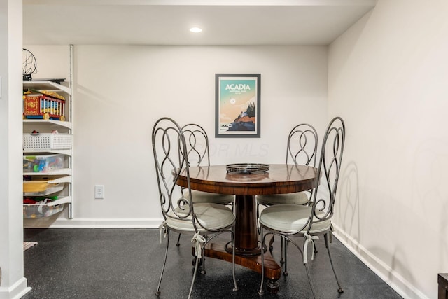 dining room with baseboards and recessed lighting