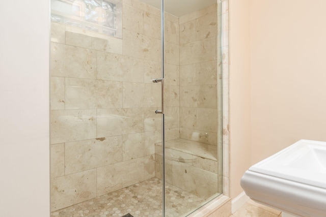full bath with a shower stall