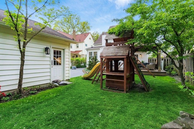 view of playground with a deck