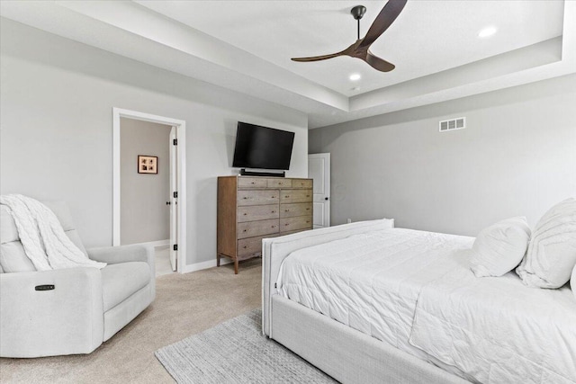 9129 Coe Dr, Plain City, OH 43064 - bedroom with light colored carpet, recessed lighting, a ceiling fan, a tray ceiling, and baseboards