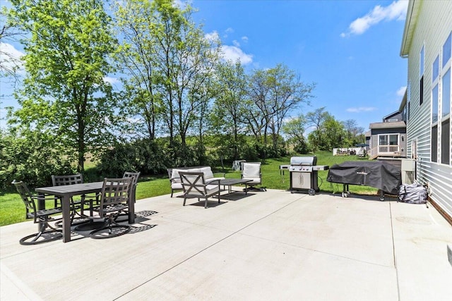 9129 Coe Dr, Plain City, OH 43064 - view of patio with grilling area, outdoor dining area, and view of scattered trees