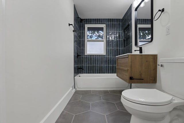 3610-3612 Grove City Rd, Grove City, OH 43123 - bathroom featuring toilet, washtub / shower combination, tile patterned floors, baseboards, and vanity