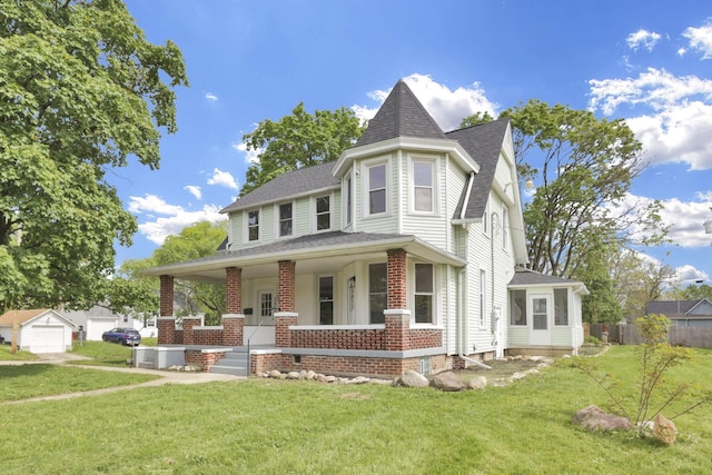 3610-3612 Grove City Rd, Grove City, OH 43123 - victorian home with a porch, brick siding, roof with shingles, a detached garage, and an outbuilding