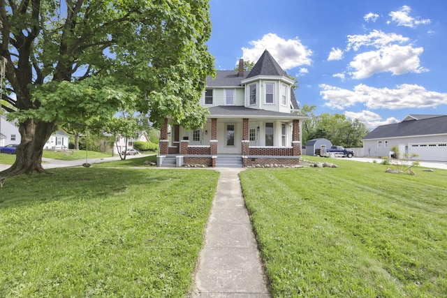 3610-3612 Grove City Rd, Grove City, OH 43123 - victorian house featuring brick siding, covered porch, a front yard, a shingled roof, and central AC unit